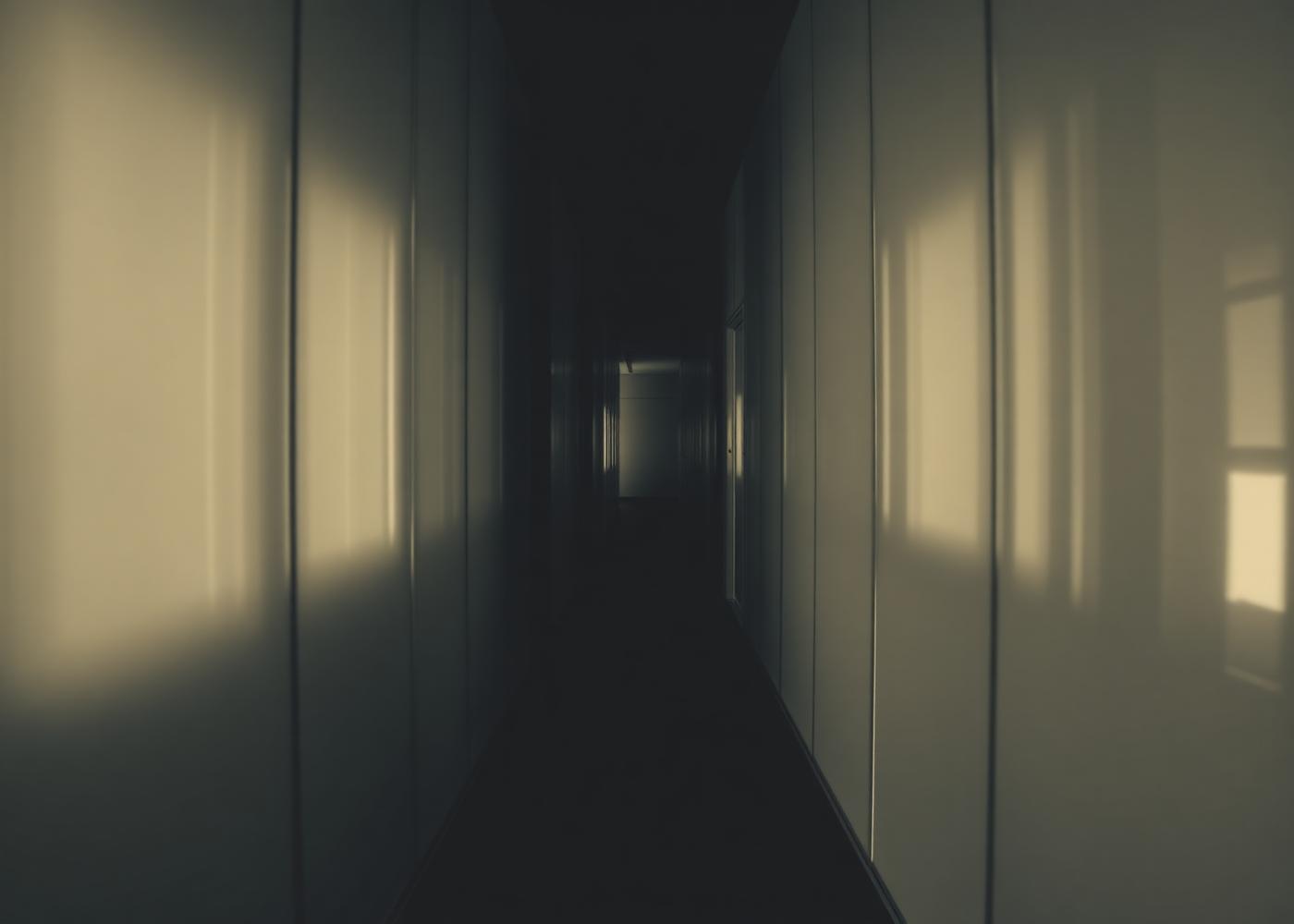 Modern glass office corridor with soft daylight