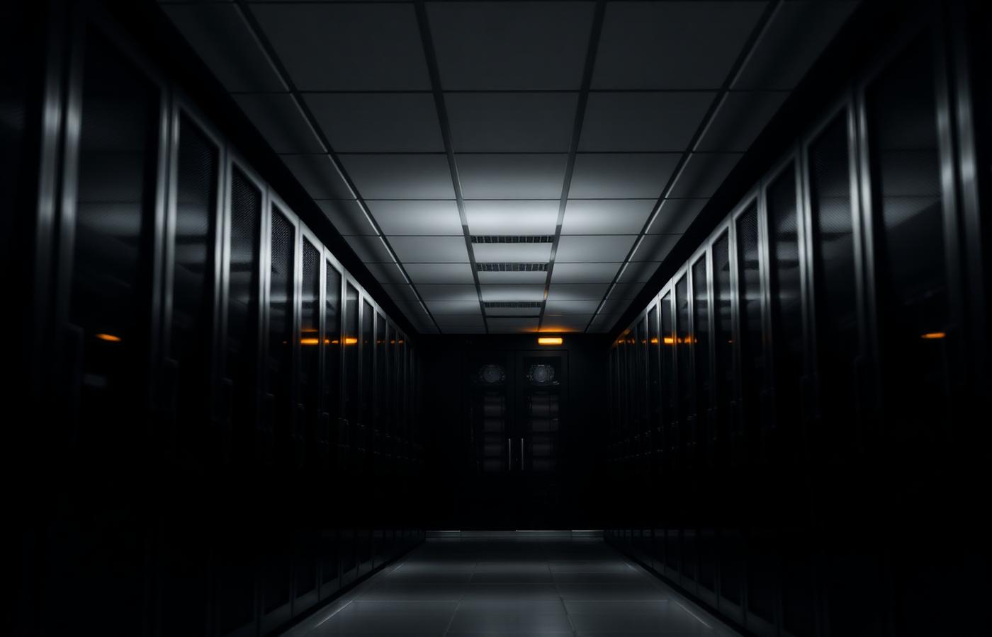 Long corridor of illuminated server racks in a modern data center